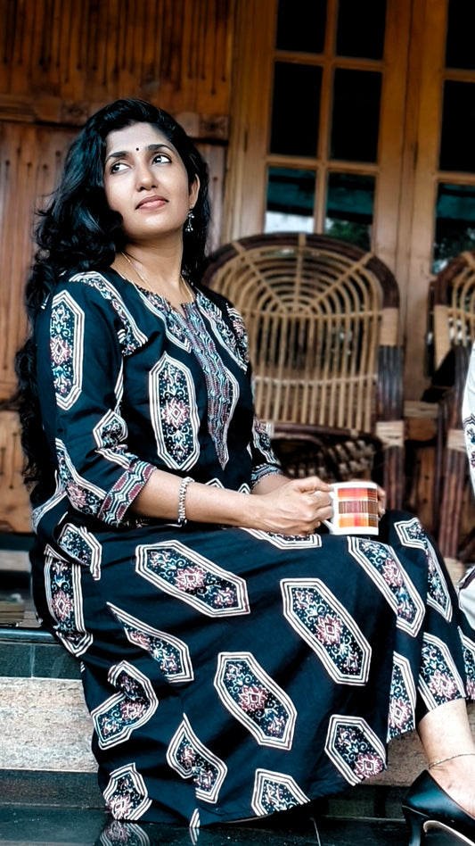 women wearing black screen printed ajrak aline kurat
